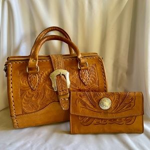 Vintage American West small duffle type bag with matching wallet. Silver buckles